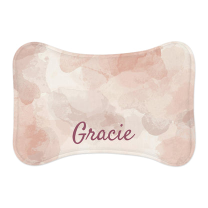 Pink watercolor personalized pet feeding mat with printed pet name, made for pets to keep bowls stable and protect flooring.