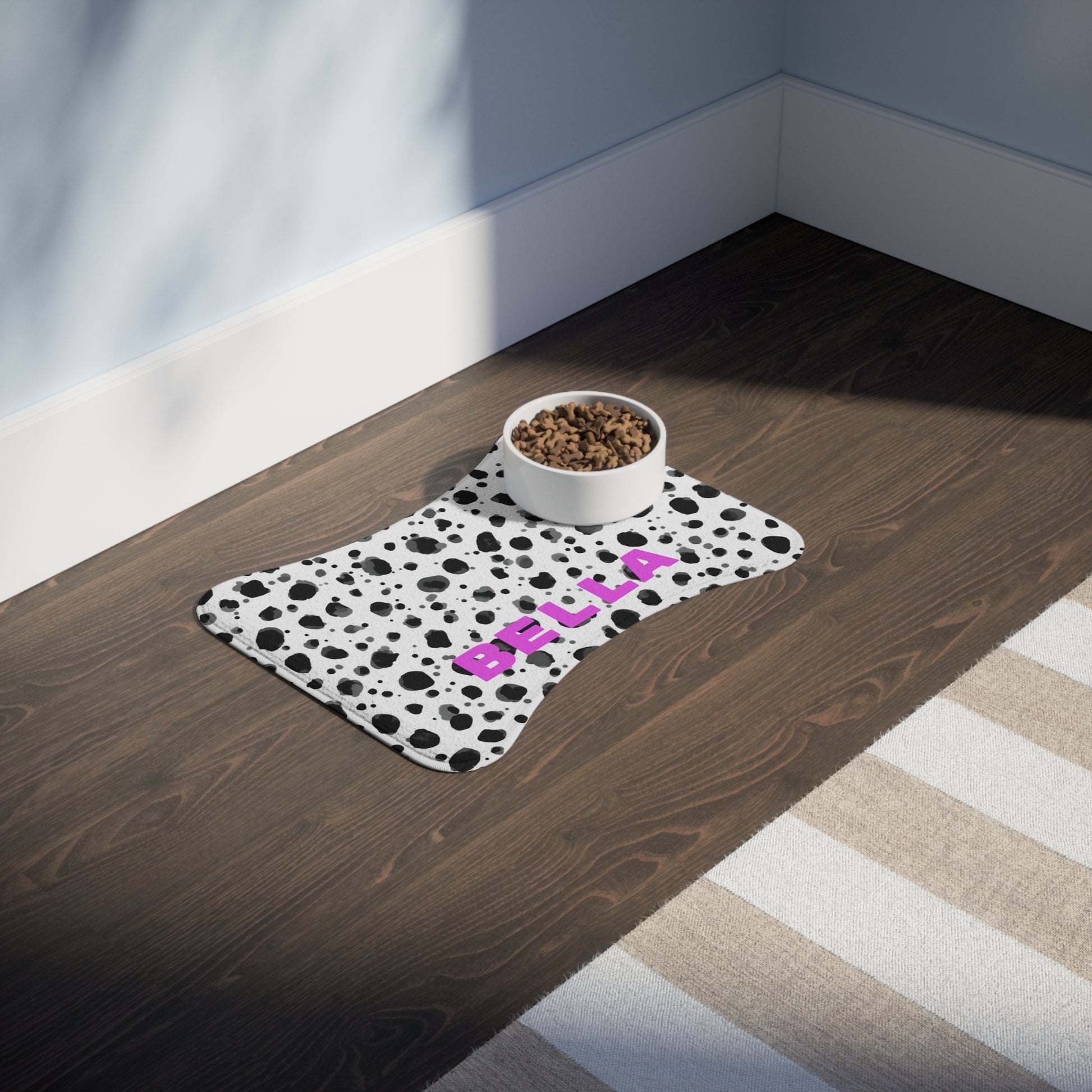 Black and white speckled personalized pet feeding mat with printed design, made for pets, by Printify.