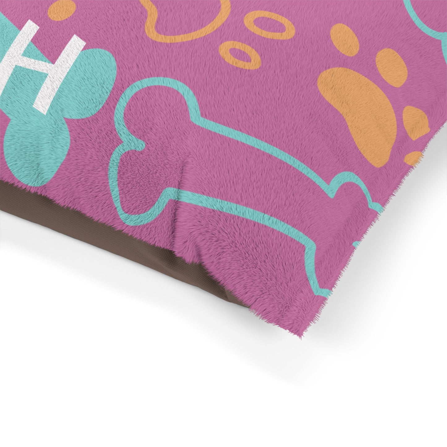 Pink personalized pet bed with bone pattern, soft fabric for dogs or cats, by Printify, designed for comfort and style.