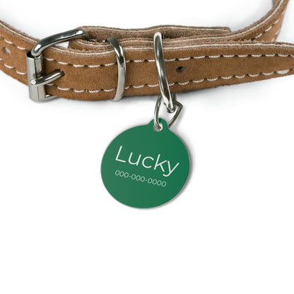 Green personalized pet ID tag with engraved details, designed for pets, by Printify, showing the tag's shape and customizable text.