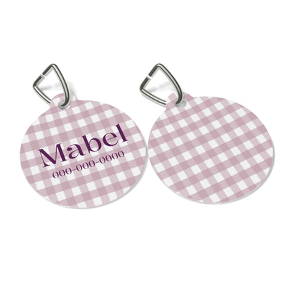 Personalized pet ID tag with lilac gingham pattern, featuring a metal ring for attaching to a pet's collar.