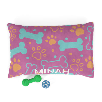 Personalized pink pet bed with bone pattern, soft fabric for small dogs or cats, by Printify.