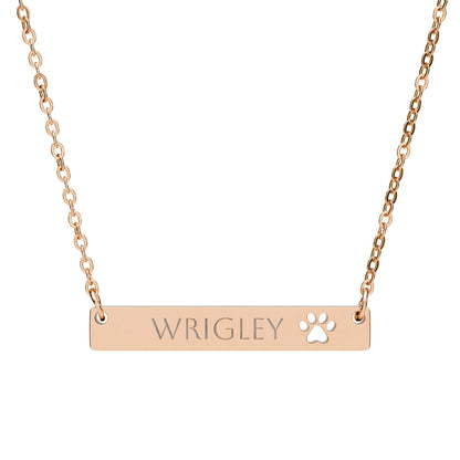 Personalized paw cutout bar necklace with engraved pet name, silver-tone jewelry accessory with a sleek modern design.