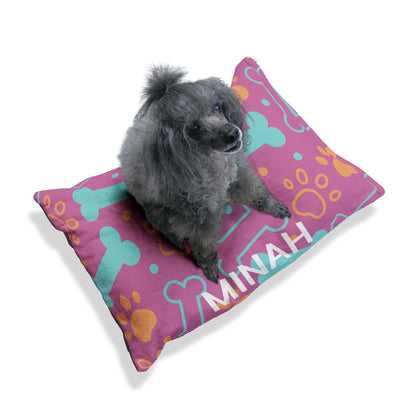 Personalized pink pet bed with bone pattern for dogs or cats, featuring custom embroidery, by Printify.