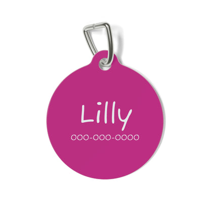 Pink personalized pet ID tag from Printify featuring engraved pet name and contact details on a durable metal tag.