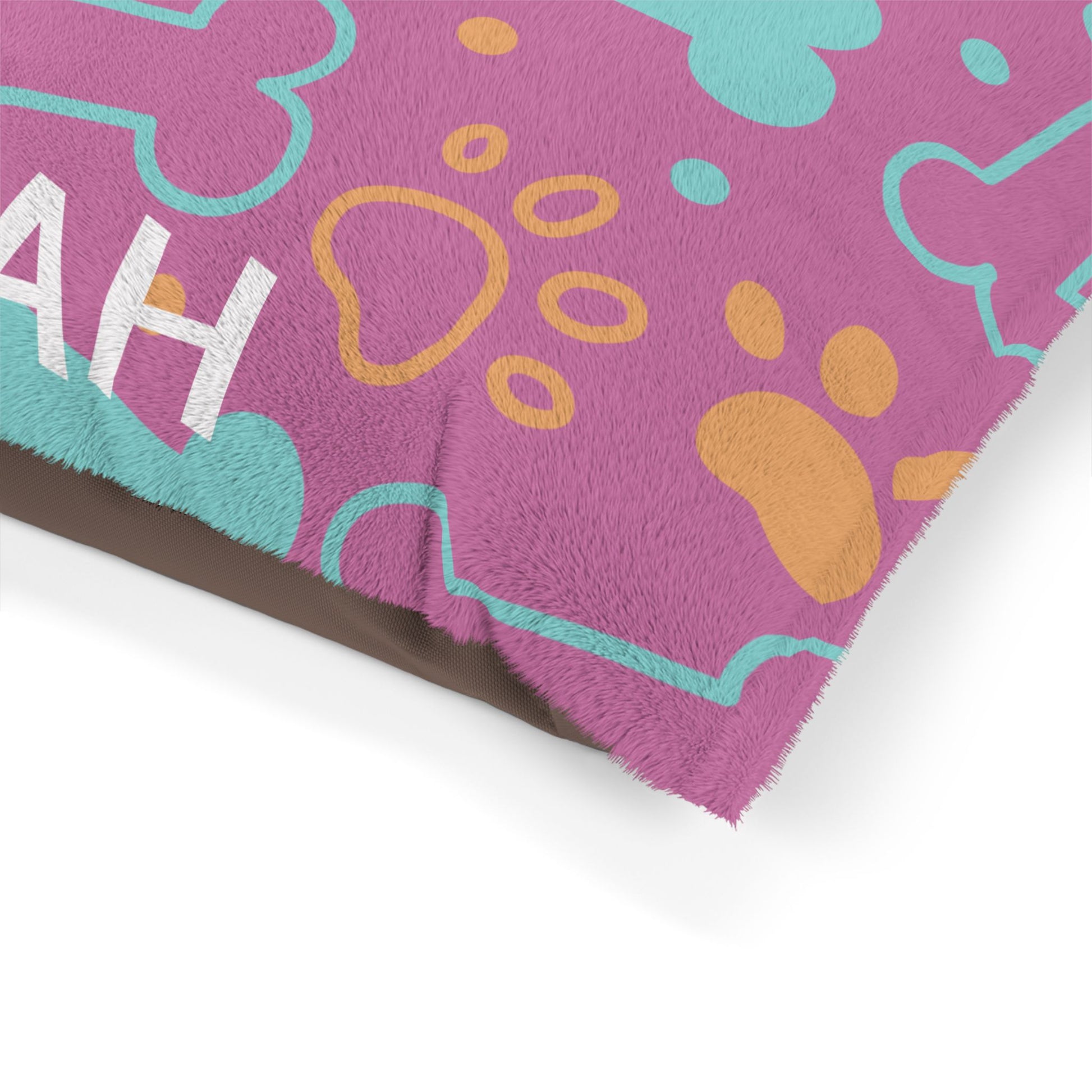Pink personalized pet bed with bone pattern, soft fabric for small pets, by Printify.