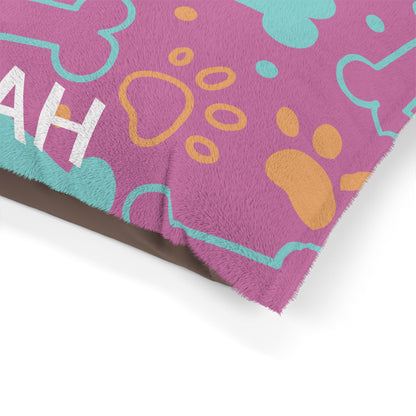 Pink personalized pet bed with bone pattern, soft fabric for small pets, by Printify.