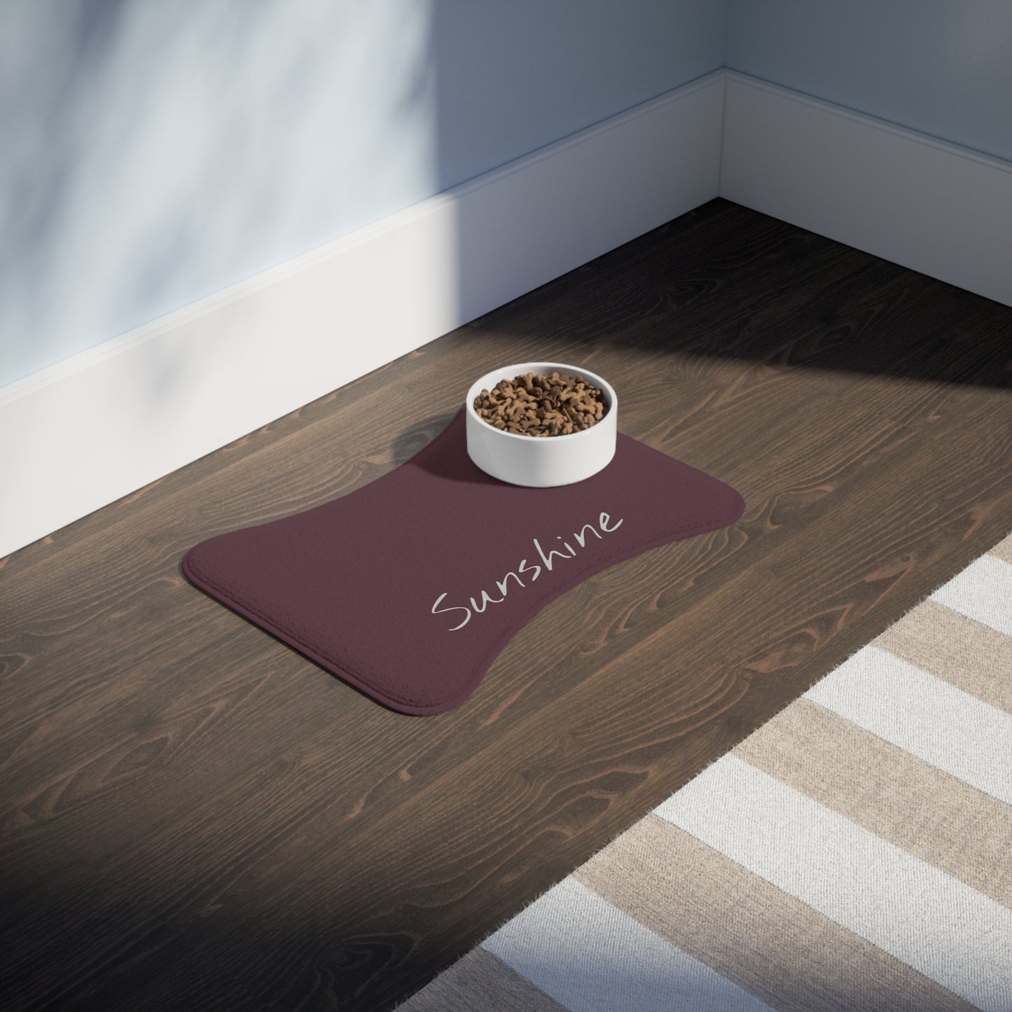 Personalized pet feeding mat with plum background featuring a customizable design, ideal for pet bowls and feeding area.