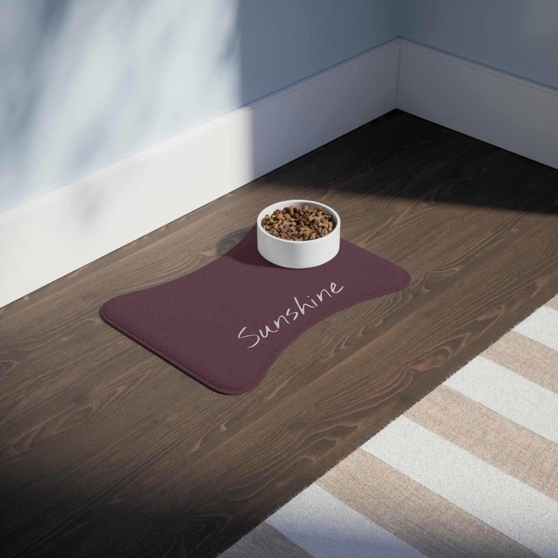 Personalized pet feeding mat with plum background featuring a customizable design, ideal for pet bowls and feeding area.