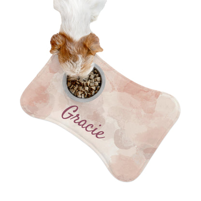 Pink watercolor personalized pet feeding mat with space for pet name, made by Printify, ideal for protecting floors during feeding.