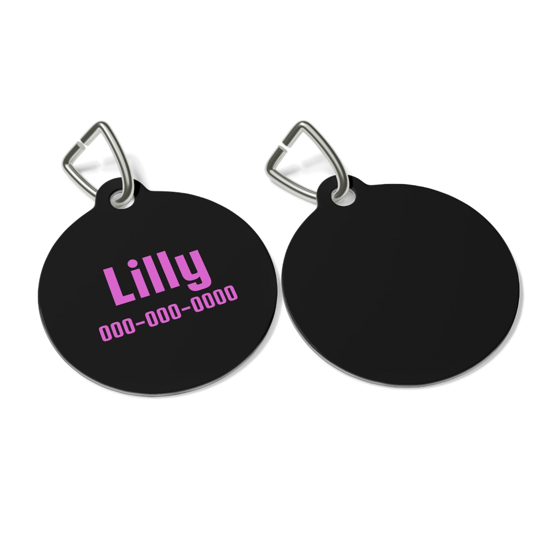 Personalized black and pink pet ID tag with engraved details, designed for pets to wear on collars.