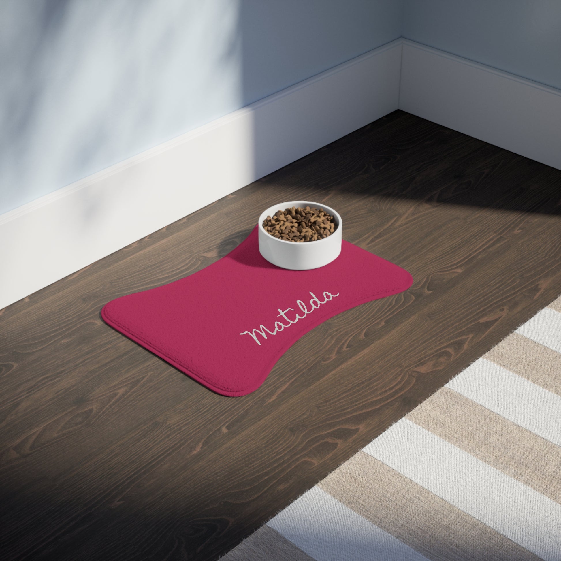 Hot pink personalized pet feeding mat with printed design, made for pets to keep feeding areas clean and stylish.