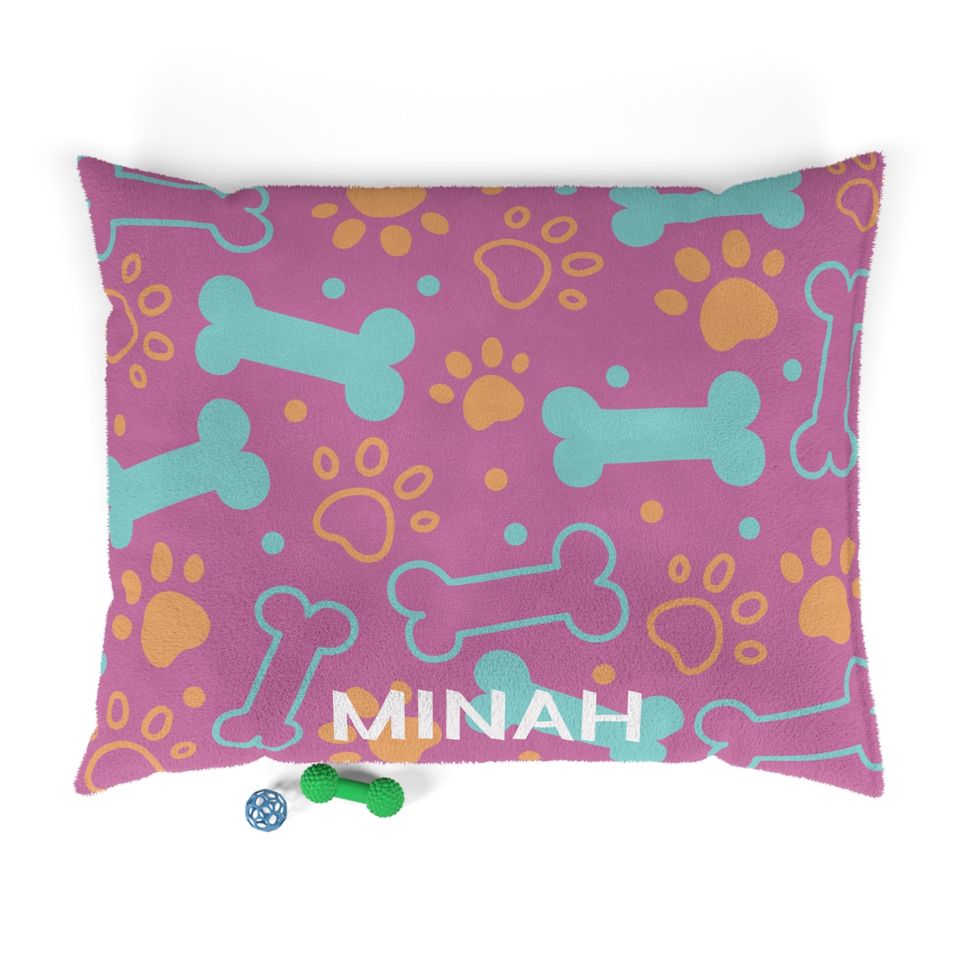 Pink personalized pet bed with bone pattern, soft fabric, designed for small dogs or cats, by Printify.