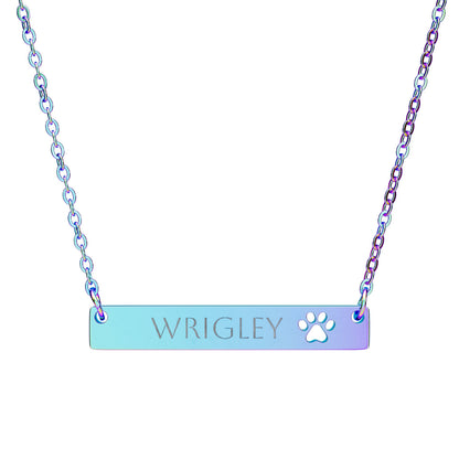 Personalized paw print cutout bar necklace with engraved pet name, stylish pet jewelry accessory.