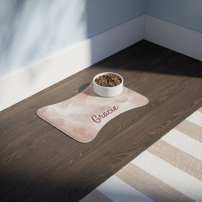 Personalized pink watercolor pet feeding mat featuring custom pet name, ideal for protecting floors during feeding.
