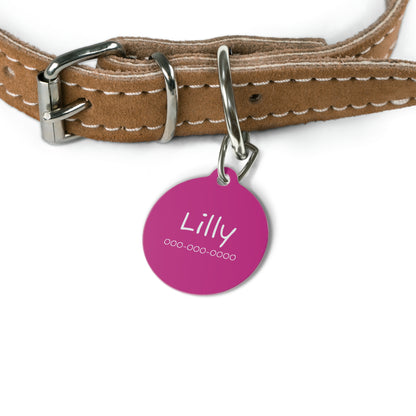 Pink personalized pet ID tag for pets featuring custom engraving, made by Printify with a sleek, durable design.