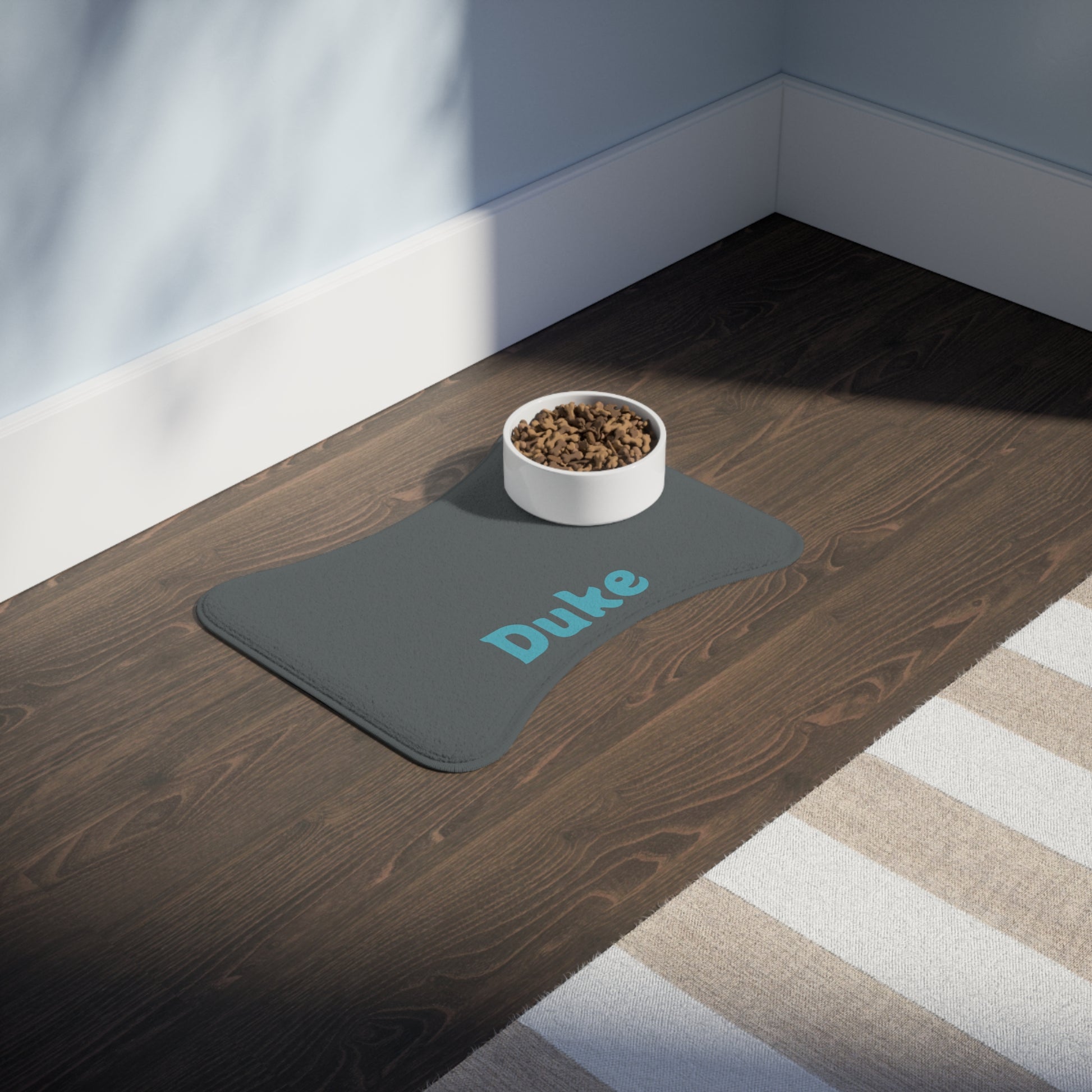 Personalized charcoal pet feeding mat from Printify, featuring a soft, non-slip surface with custom text for pets.