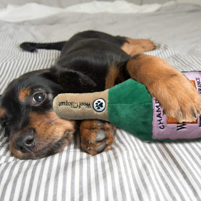 Fetch & Feature dog toy resembling a yellow wine bottle, bite-resistant, sound-emitting, machine washable, suitable for all dog breeds.
